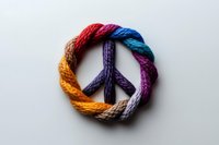 Colorful twisted rope forming peace symbol on white background, isolated design element suitable for t-shirts, posters, and graphic projects.