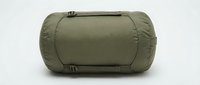 Olive green compression stuff sack or sleeping bag storage pouch with straps and buckles, isolated on white background for camping and outdoor gear organization.