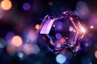Sparkling hexagonal crystal with purple and orange bokeh lights creating magical atmosphere against dark background, suitable for luxury design projects.