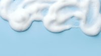 White fluffy clouds floating against soft blue sky background creating dreamy atmospheric weather scene for design projects and creative applications.