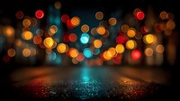 Colorful bokeh lights creating warm and cool tones over sparkling glittery surface. Abstract background for celebrations, parties, and festive designs.