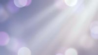 Soft purple and pink bokeh lights creating dreamy blurred background with gentle luminous circles and ethereal glow for romantic designs.