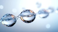 Macro photography of pure water drops connected in chain formation against blurred light background, showcasing surface tension and natural refraction patterns.