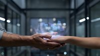 Business partnership handshake with digital holographic interface technology in modern office environment for corporate collaboration concepts.