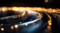 Glowing light trails curve through darkness with golden bokeh effects creating dynamic motion and energy, abstract background for technology and innovation concepts.