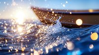 Ocean wave splashing with sunlight creating sparkling water droplets against blue sea background, golden hour lighting creates magical bokeh effect.