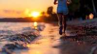 Athletic woman jogging on beach at sunset, water splashing under feet. Golden hour workout with ocean waves and warm sunlight creates inspiring fitness scene.
