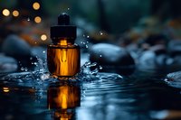 Amber glass dropper bottle with water splash reflection against dark background with bokeh lights, dramatic product photography for cosmetic advertising.