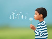 Young Hispanic boy in striped shirt blowing dandelion with wind turbines and plant icons, symbolizing renewable energy and environmental awareness.