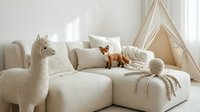 Cozy neutral living room with beige sofa, decorative llama pillow, wooden fox figurine and children teepee tent creating warm family space.