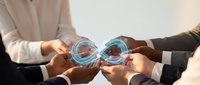 Young diverse male professionals in business attire holding glowing digital spheres with interconnected network lines, representing data exchange, collaboration, and technology partnership.