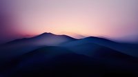 Misty mountain silhouettes at dawn with purple pink gradient sky. Serene landscape photography for meditation wellness travel content.