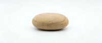 Single smooth brown river stone isolated on white background for spa wellness meditation and natural decoration projects.