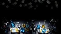 Laboratory glassware and scientific equipment arranged on dark surface with bokeh lights background for research and chemistry experiments.