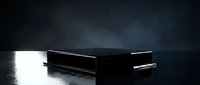 Sleek black rectangular product display platform with minimalist design on reflective wet surface under dramatic moody lighting for modern showcase.