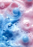 Abstract liquid art background with pink and blue swirling colors, water drops and bubbles creating dreamy cosmic effect. Suitable for beauty product packaging.