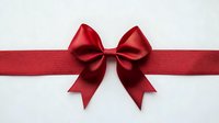Red satin ribbon bow isolated on white background for gift wrapping, holiday decorations, Christmas presents, birthday cards and festive design projects.