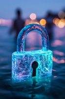 Glowing blue ice padlock with keyhole against blurred city lights background creates magical winter atmosphere for security and protection concepts.