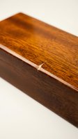 Handcrafted wooden box with rich grain pattern and smooth finish for storage, jewelry, gifts, and home organization on neutral background.