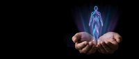 Glowing holographic human figure floating above cupped hands against dark background for healthcare, technology and medical innovation concepts.