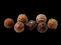Assorted chocolate truffles and bonbons isolated on transparent background, ready for culinary design, packaging, print-on-demand, and digital food graphics.