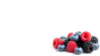 Fresh mixed berries including blueberries, raspberries and blackberries isolated on white background for healthy eating and nutrition concepts.