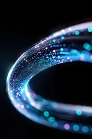 Glowing curved light trail with blue and pink bokeh particles flowing in spiral motion against dark background, creating futuristic technology effect.