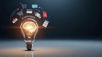 Glowing light bulb with e-commerce icons floating around representing online business innovation and digital marketing concepts for web design.