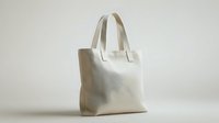 Eco-friendly cream canvas tote bag with handles isolated on neutral background for sustainable shopping and everyday use.