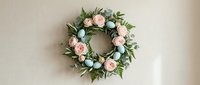 Elegant floral wreath with soft pink roses and eucalyptus leaves on neutral background for home decor, weddings, and seasonal celebrations.