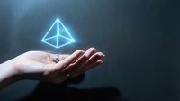 Female hand holding a glowing blue holographic pyramid floating above palm, symbolizing technology, innovation, and digital future concepts.