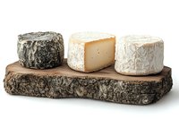 Artisanal cheese selection on rustic wooden board featuring aged black rind, white mold and soft ripened varieties arranged for gourmet food photography.