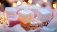 Sugar cubes with bokeh lights in background creating magical winter atmosphere, soft focus macro photography on metal grid with warm glow and sparkles.