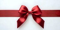 Red satin ribbon bow on white background for gift wrapping, holiday decorations and festive celebrations.