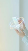 Businessman hands holding smartphone with glowing digital network connections and data transfer visualization for modern technology concepts.