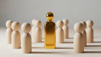 Golden wooden figure stands out among natural wood team members representing leadership excellence and business success in corporate environment.
