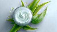 Luxurious moisturizing cream jar with fresh aloe vera leaves and water drops on light background, top view composition for cosmetic and skincare products.
