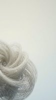 Abstract flowing mesh ribbons creating dynamic swirls on neutral background for modern design projects and digital art applications.
