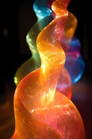 Vibrant flowing abstract waves with luminous orange blue purple gradients creating dynamic energy motion on dark background for modern digital art.