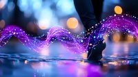 Magical purple light trail following dancing feet on wet reflective surface with bokeh lights creating dreamy atmosphere. Artistic dance photography.