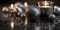 Shiny disco balls with glowing candles on dark reflective surface creating festive atmosphere for party or celebration event.