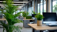 Modern open office workspace with green plants, wooden desks and laptop computer. Natural light from windows creates welcoming atmosphere for productive work environment.