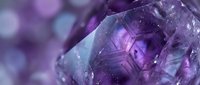 Purple amethyst crystal with geometric facets and natural formations against soft bokeh background for jewelry design and gemstone collections.