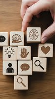 Hand placing wooden blocks with mental health and psychology icons including brain, lightbulb, heart, and communication symbols on wood surface.