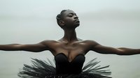 Young African American woman in black tutu dress with outstretched arms against cloudy sky, expressing freedom and grace through contemporary dance movement.