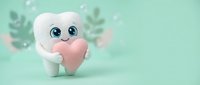 Cute cartoon tooth character holding pink heart on mint green background with soft bokeh lights for dental care and oral health campaigns.