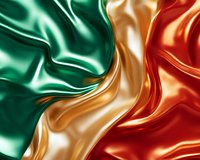 Luxurious flowing silk fabric in emerald green, gold and red colors creates elegant waves and folds with glossy satin texture and smooth rippling effect.