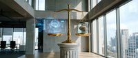 Golden scales of justice on marble pedestal in modern corporate law office with city skyline view through floor-to-ceiling windows.
