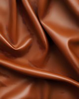 Smooth flowing waves of rich brown satin fabric create elegant folds and curves against dark background, suitable for luxury product marketing and fashion design.