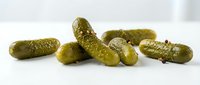 Pickled cucumbers isolated on white background, ready for food packaging, recipe blogs, culinary design, and restaurant menus.